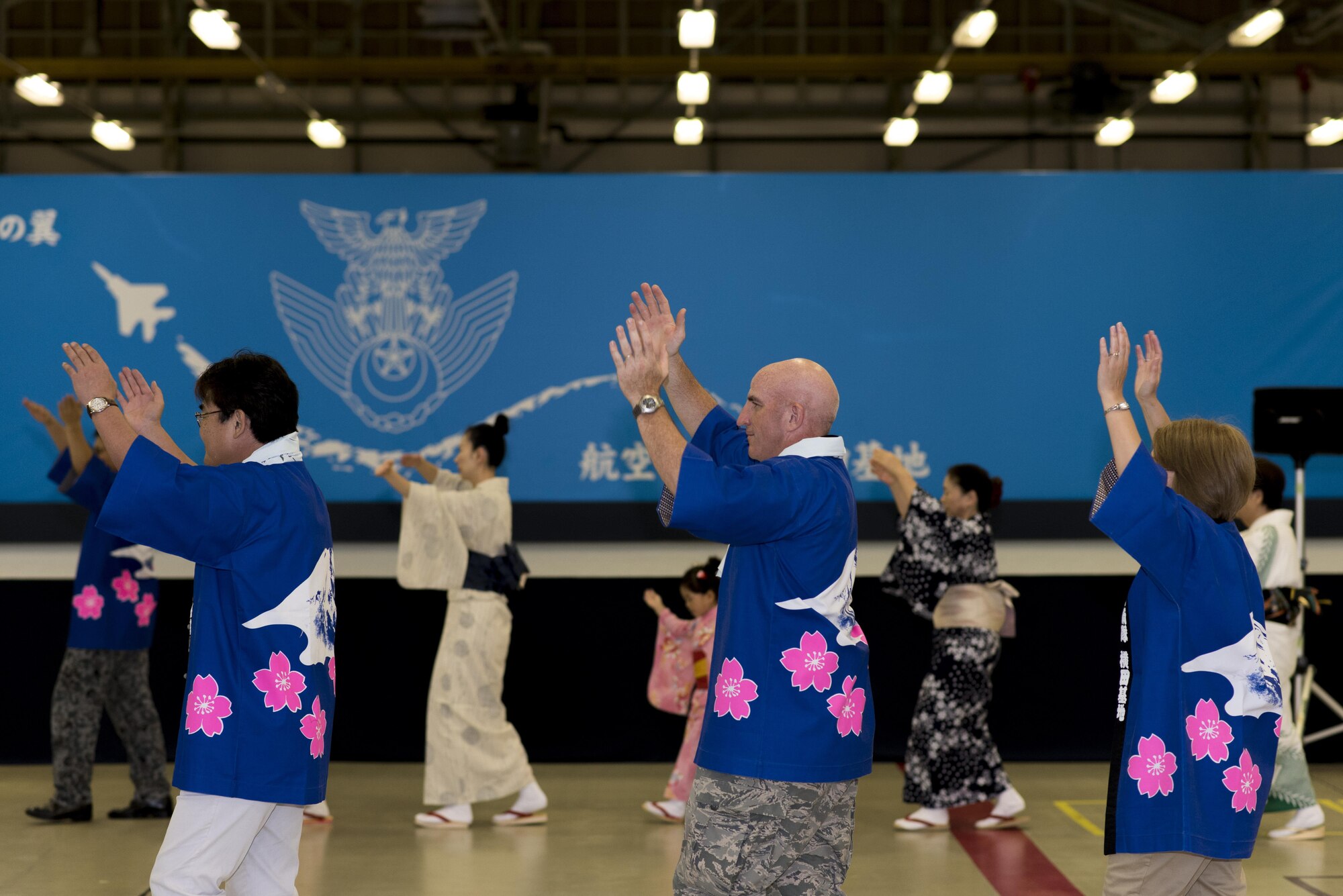 Col. Kenneth Moss, 374th Airlift Wing commander, participates in a Bon dance during the 2016 Friendship Festival at Yokota Air Base, Japan, Sept. 18, 2016. In 2015, more than 185,000 people attended. (U.S. Air Force photo by Staff Sgt. Michael Washburn/Released)