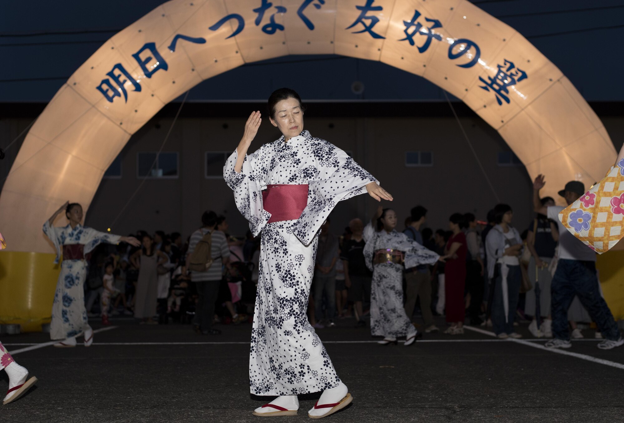 A Japanese woman performs during a Bon dance during the 2016 Friendship Festival at Yokota Air Base, Japan, Sept. 18, 2016. Friendship Festival featured music, dances, static aircraft displays and various other performances. (U.S. Air Force photo by Staff Sgt. Michael Washburn/Released)