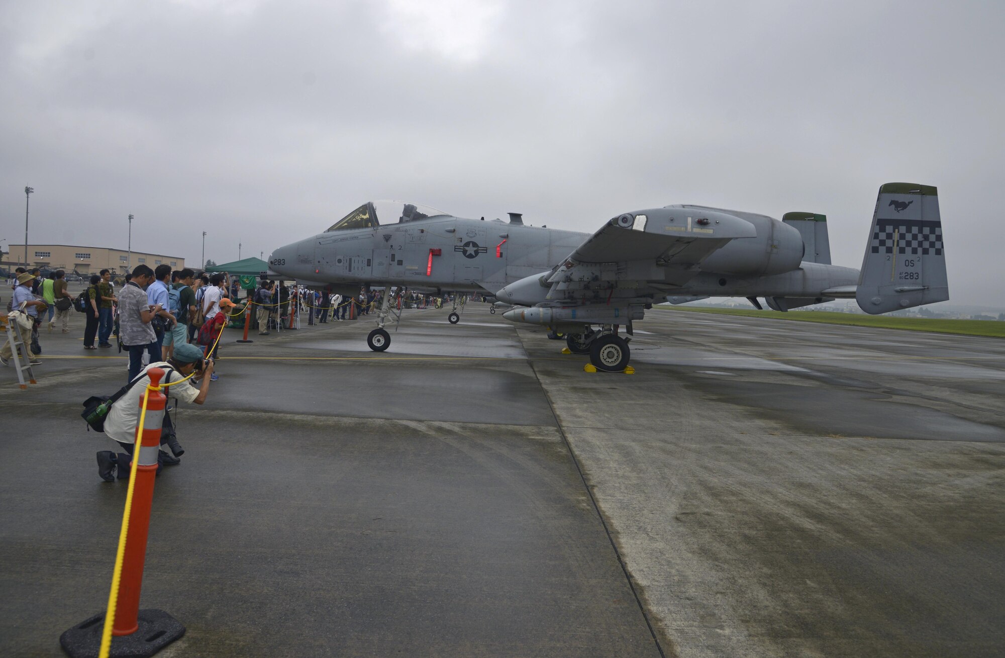 Spectators take pictures of A-10 Thunderbolt II aircraft at the Friendship Festival at Yokota Air Base, Japan, Sept. 18, 2016. The festival was an opportunity for visitors to experience American fun and culture, while strengthening the bonds between Yokota and the local communities. (U.S. Air Force photo by Senior Airman David Owsianka/Released)