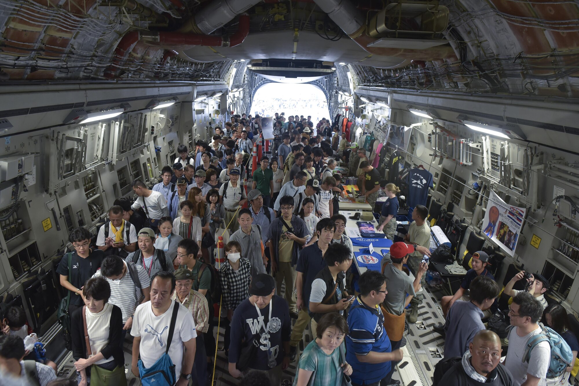 Japanese festival attendees enter a C-17 Globemaster III during the 2016 Friendship Festival at Yokota Air Base, Japan, Sept. 18, 2016. The C-17 was assigned to Joint Base Pearl Harbor-Hickam, Hawaii. (U.S. Air Force photo by Machiko Imai/Released)