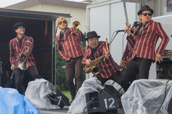 A local band performs on the outdoor stage at the 2016 Friendship Festival at Yokota Air Base, Japan, Sept. 18, 2016. The festival included more than 15 musical performances across the two stages. (U.S. Air Force photo by Senior Airman David C. Danford/Released)