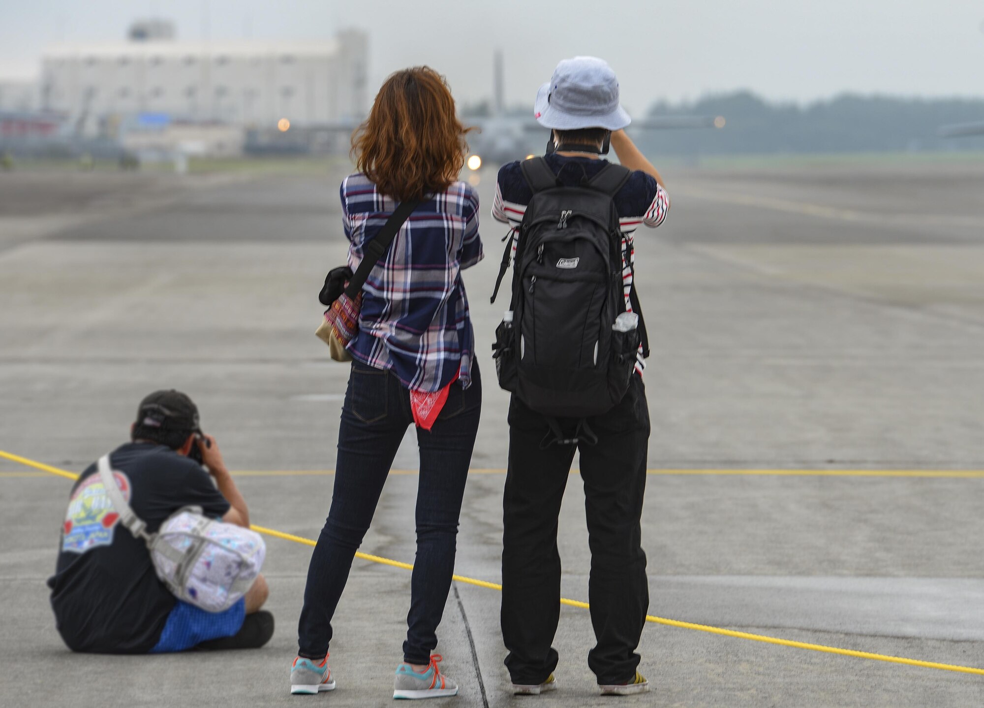 Festivalgoers take pictures of a C-130H Hercules assigned to the 374th Airlift Wing during the 2016 Japanese-American Friendship Festival at Yokota Air Base, Japan, Sept. 18, 2016. The festival is held annually at Yokota; more than 185,000 festivalgoers attended in 2015. (U.S. Air Force photo by Airman 1st Class Elizabeth Baker/Released)