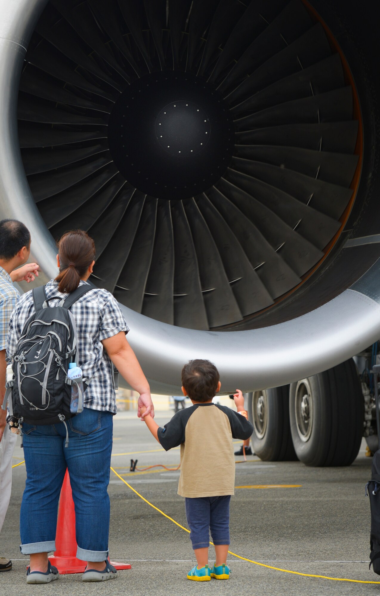 Visitors observe the aircraft static display booth at the 2016 Japanese-American Friendship Festival at Yokota Air Base, Japan, Sept. 18, 2016. The festival gives community members a chance to come onto Yokota to see static aircraft, witness military demonstrations, learn about the capabilities and training done at Yokota and to meet with the US and Japan Self-Defense Force members who work and live here. (U.S. Air Force photo by Airman 1st Class Elizabeth Baker/Released)