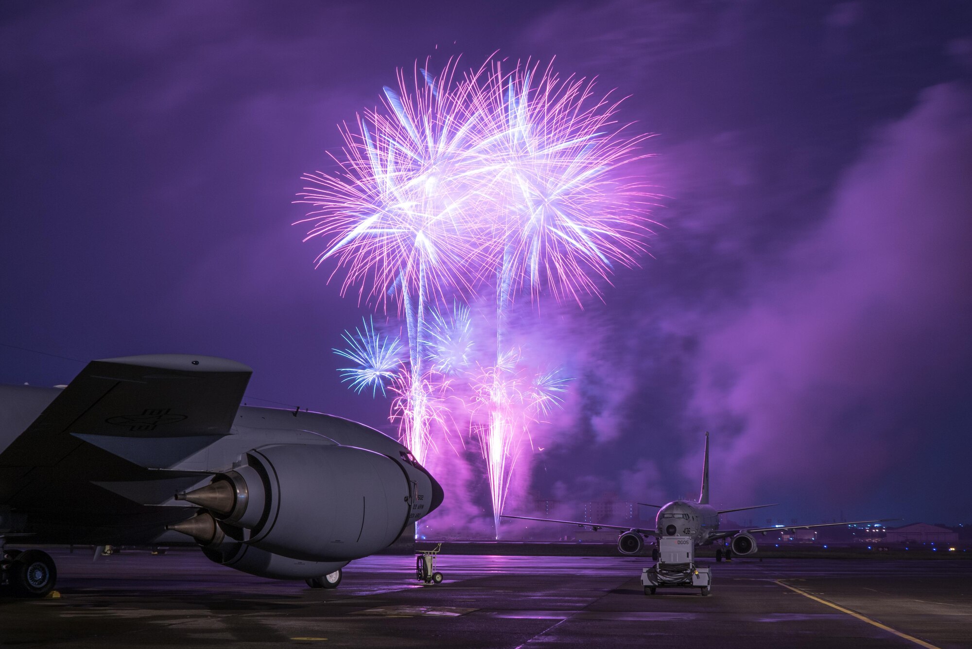 Fireworks explode over KC-135 Stratotanker at the 2016 Japanese-American Friendship Festival at Yokota Air Base, Japan, Sept. 18, 2016. Tens of thousands of people attend the festival every year to learn more about the US military and American culture.  (U.S. Air Force photo by Senior Airman Delano Scott/Released)