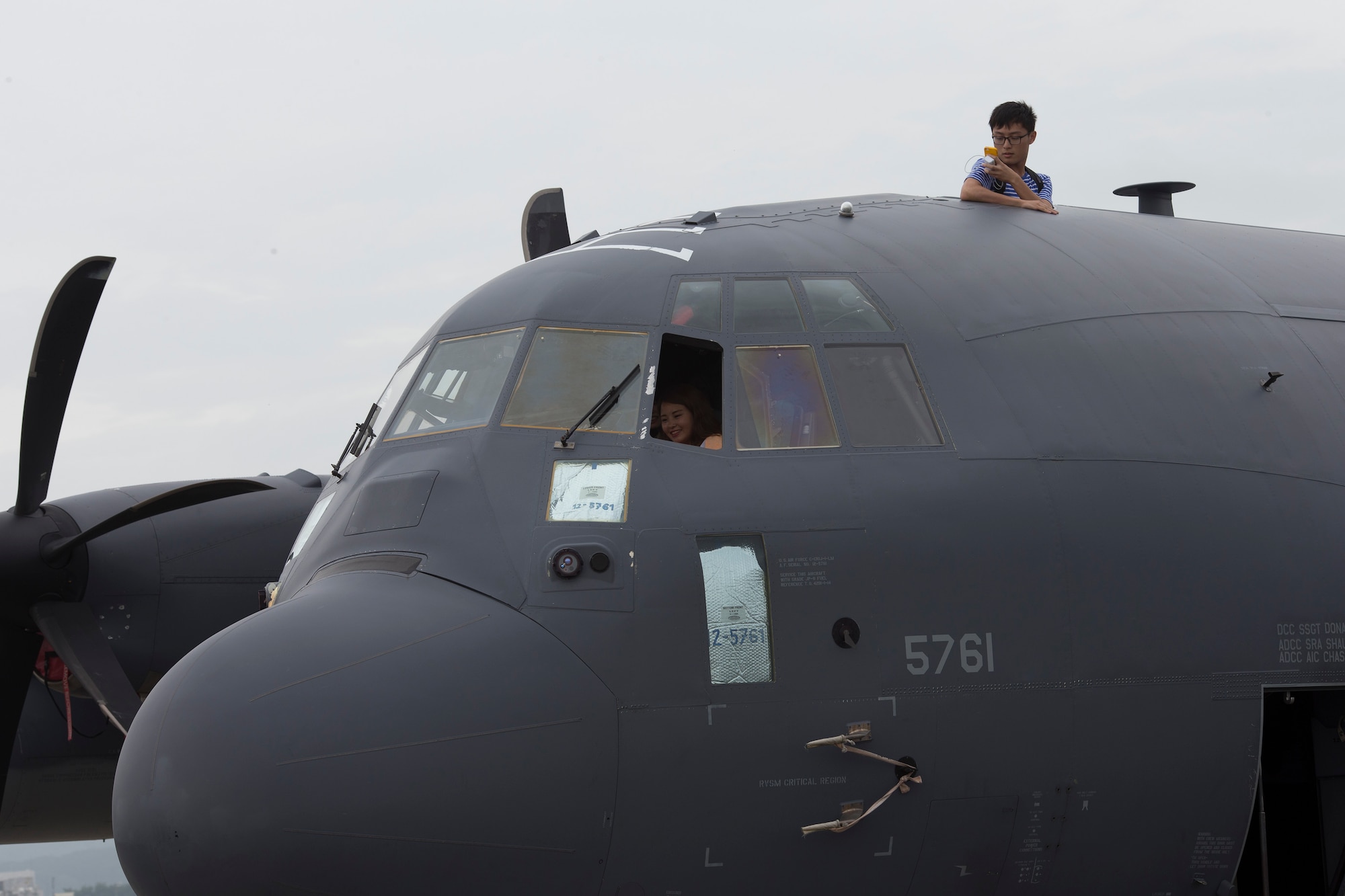 Japanese festivalgoers take photos from a MC-130J Commando II during the 2016 Friendship Festival at Yokota Air Base, Japan, Sept. 18, 2016. The MC-130J Commando II is assigned to the 353rd Special Operations Group's 17th Special Operations Squadron. (U.S. Air Force photo by Yasuo Osakabe/Released)