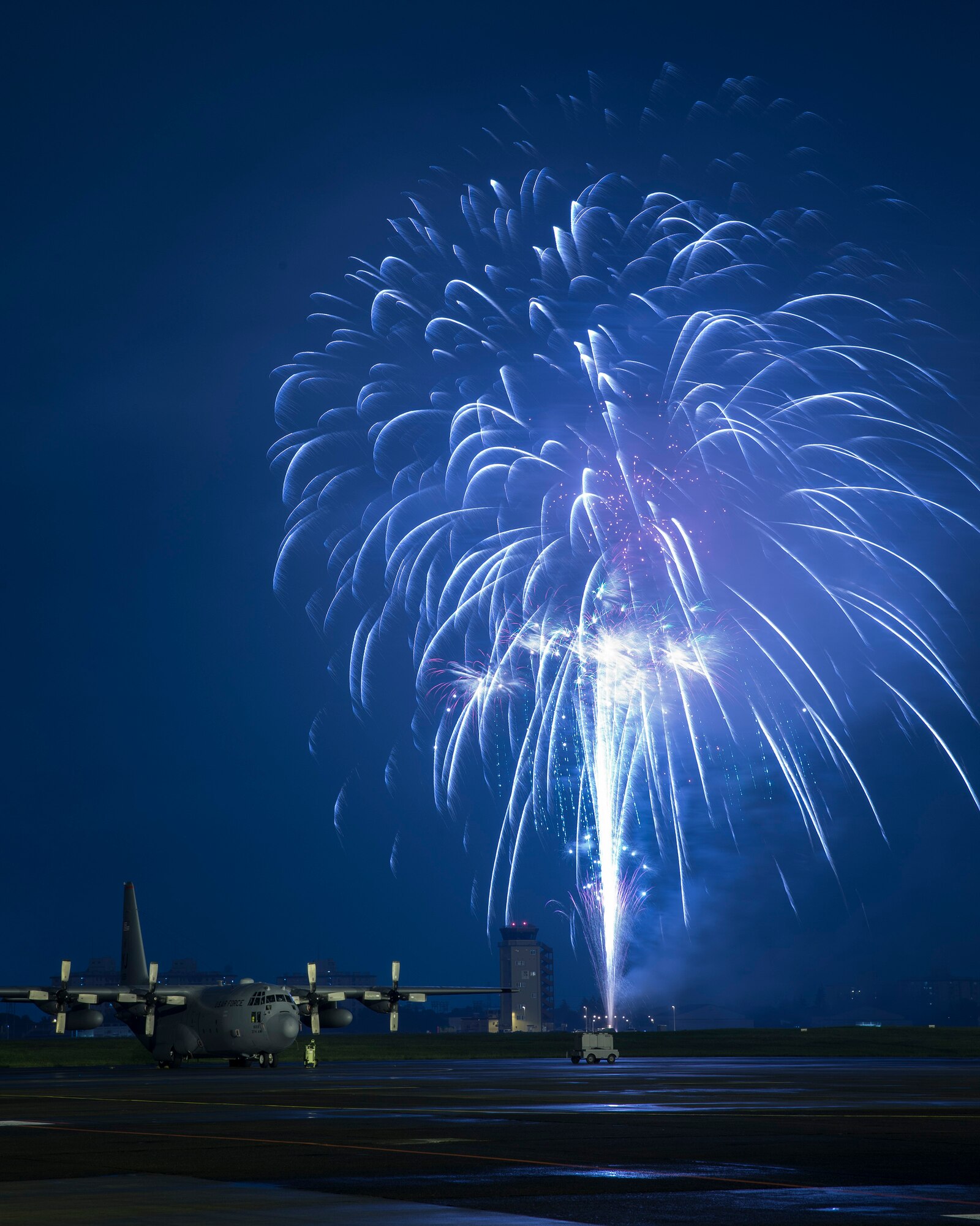 Fireworks explode behind a C-130 Hercules at the 2016 Friendship Festival at Yokota Air Base, Japan, Sept. 18, 2016. Tens of thousands of visitors attended the festival designed to bolster the bi-lateral relationship shared between the United States and Japan. In addition to static displays and live music, the festival offered a variety of American and Japanese food. (U.S. Air Force photo by Yasuo Osakabe/Released)