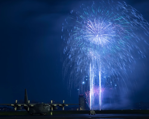 Fireworks explode behind a C-130 Hercules at the 2016 Friendship Festival at Yokota Air Base, Japan, Sept. 18, 2016. Ten of thousands visitors attended the festival designed to bolster the bi-lateral relationship shared between the United States and Japan. In addition to static displays and live music, the festival offered a variety of American and Japanese food. (U.S. Air Force photo by Yasuo Osakabe/Released)