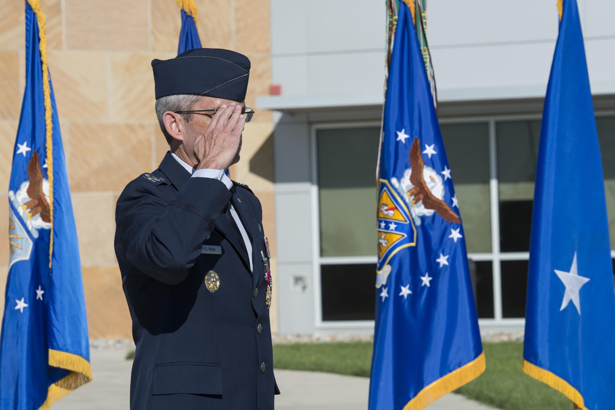 Maj. Gen. Richard W. Scobee, 10th Air Force commander, presents Col. Damon S. Feltman with the Legion of Merit award for his service during the colonel’s time as commander of the 310th Space Wing during a change of command ceremony, Schriever AFB, Colo., Sept. 17, 2016.
(U.S. Air Force photo by Staff Sgt. Christopher Moore/Released) 