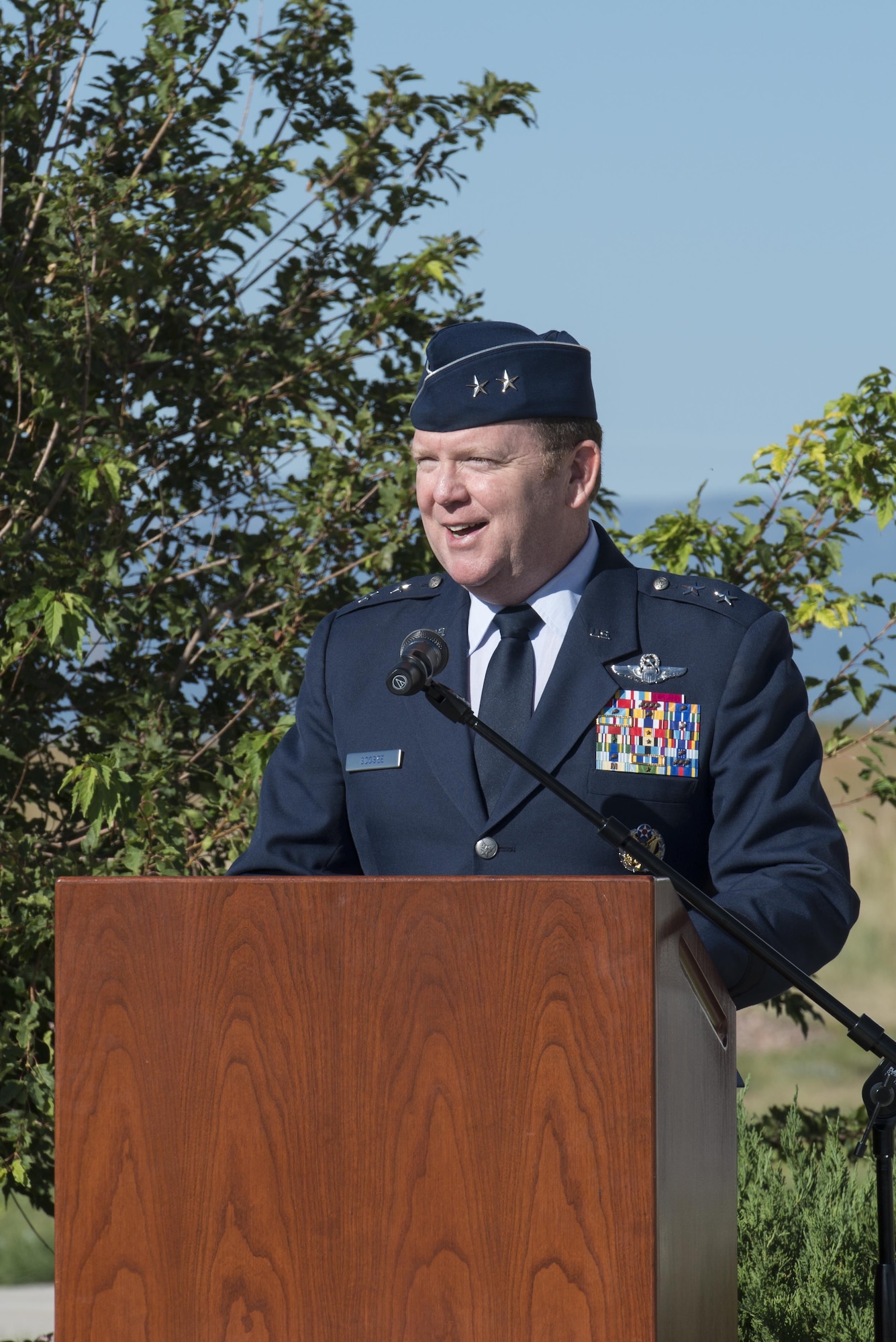 Maj. Gen. Richard W. Scobee, 10th Air Force commander, addresses the audience during his opening remarks during a change of command ceremony for the 310th Space Wing, commemorating the change from Col. Damon S. Feltman to Col. Traci L. Kueker-Murphy, Schriever AFB, Colo., Sept. 17, 2016. 
(U.S. Air Force photo by Staff Sgt. Christopher Moore/Released) 