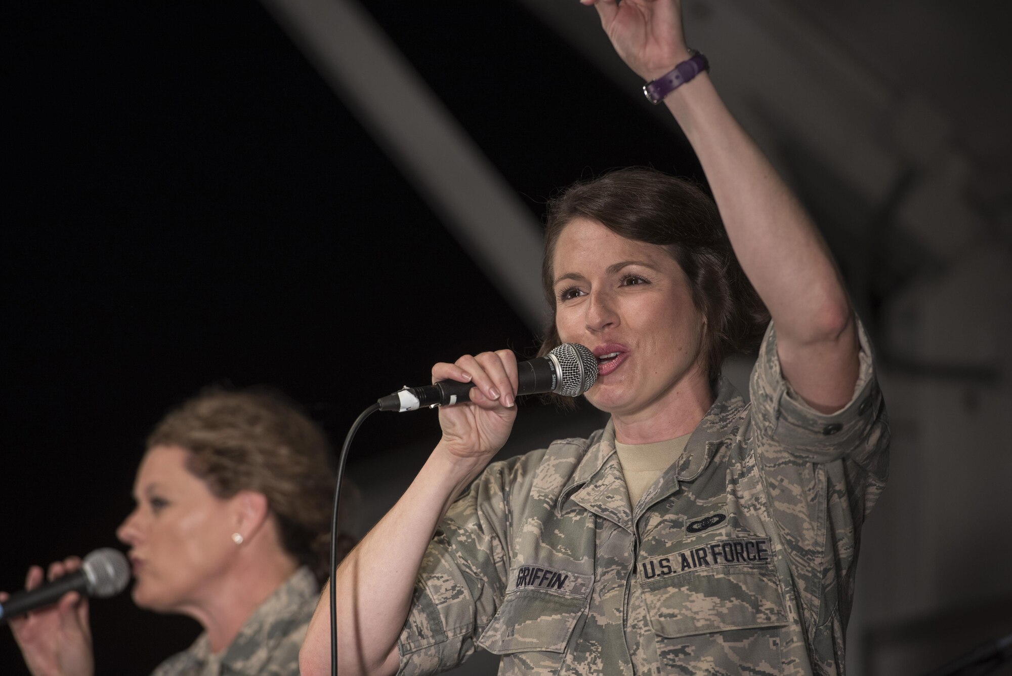 Staff Sgt. Joanne Griffin, vocalist with the Band of the Pacific-Asia, performs during the 2016 Japanese- American Friendship Festival at Yokota Air Base, Japan, Sept. 17, 2016. The festival gives community members a chance to come onto Yokota to see static aircraft, witness military demonstrations, learn about the capabilities and training done at Yokota and to meet with the US and Japan Self-Defense Force members who work and live here. (U.S. Air Force photo by Staff Sgt. Cody H. Ramirez/Released)