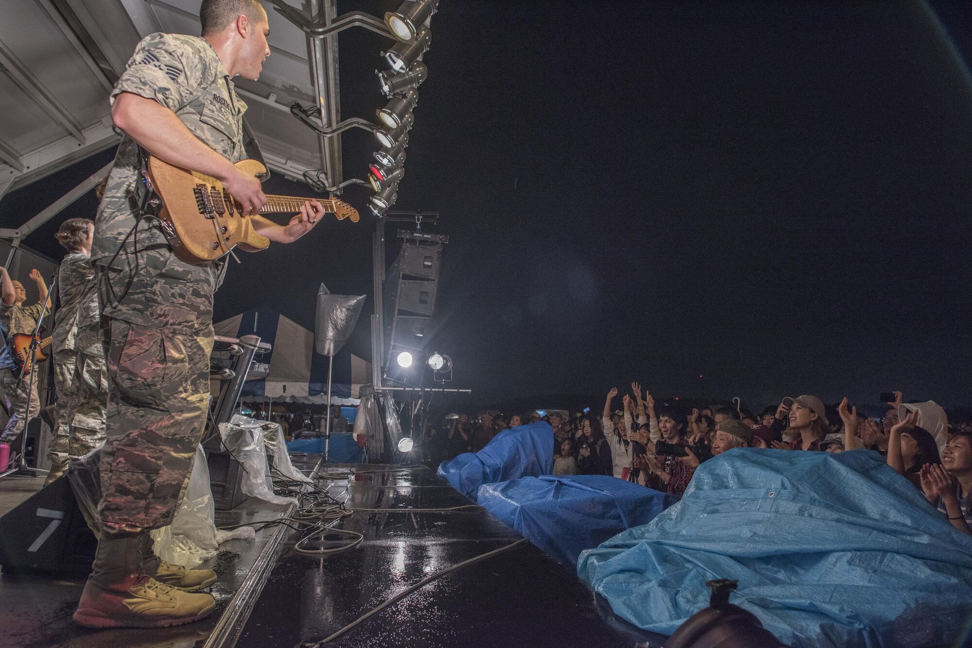 Staff Sgt. Alberto Rosado-Perez, guitarist with the Band of the Pacific-Asia, performs a solo rift for fans during the 2016 Japanese-American Friendship Festival at Yokota Air Base, Japan, Sept. 17, 2016. Tens of thousands of people attend the festival every year to learn more about the US military and American culture and to enjoy performances and demonstrations. More than 185,000 people attended the festival in 2015. (U.S. Air Force photo by Staff Sgt. Cody H. Ramirez/Released)