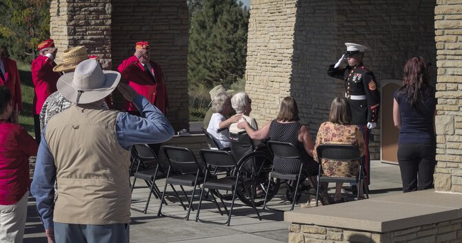 A Marine presents Anne Rissman with a flag during her life-long husband’s funeral Aug. 22, 2016, at the Idaho State Veterans Cemetery in Garden City, Idaho. Jim Rissman, Anne’s husband, served in the U.S. Marine Corps during World War II. Anne and Jim met shortly after WWII while attending Michigan University, using their G.I. Bill, at the beginning of their sophomore year, and were married later that year. (U.S. Air Force photo by Tech. Sgt. Samuel Morse)