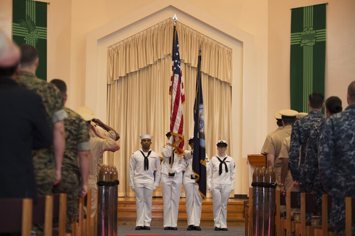 A U.S. Navy Color Guard, presents the colors during a promotion ceremony in the Marine Memorial Chapel at Marine Corps Air Station Iwakuni, Japan, Sept. 16, 2016. The colors are a part of every traditional ceremony and honor the beliefs in which each branch of service was founded upon. (U.S. Marine Corps photo by Lance Cpl. Joseph Abrego) 