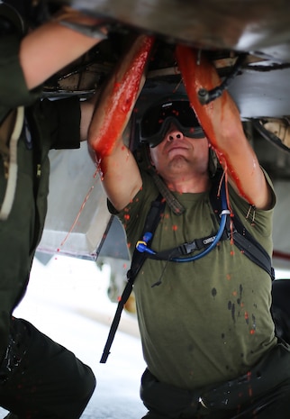 U.S. Marine Corps airframes mechanics assigned to Marine All Weather Fighter Attack Squadron (VMFA(AW)) 242 removes a hydraulic pump from an F/A-18D Hornet after a flight mission during Exercise Valiant Shield 16 at Andersen Air Force Base, Guam, Sept. 18, 2016. Powerliners, airframes mechanics, communication navigation and ordnance technicians, work around the clock to ensure flight schedules are met for aviation operations during the exercise. During this U.S.-only, biennial field training exercise, F/A-18D Hornets flew in a plethora of missions that emphasize joint integration, interoperability and expeditionary readiness. (U.S. Marine Corps photo by Sgt. Jessica Quezada)