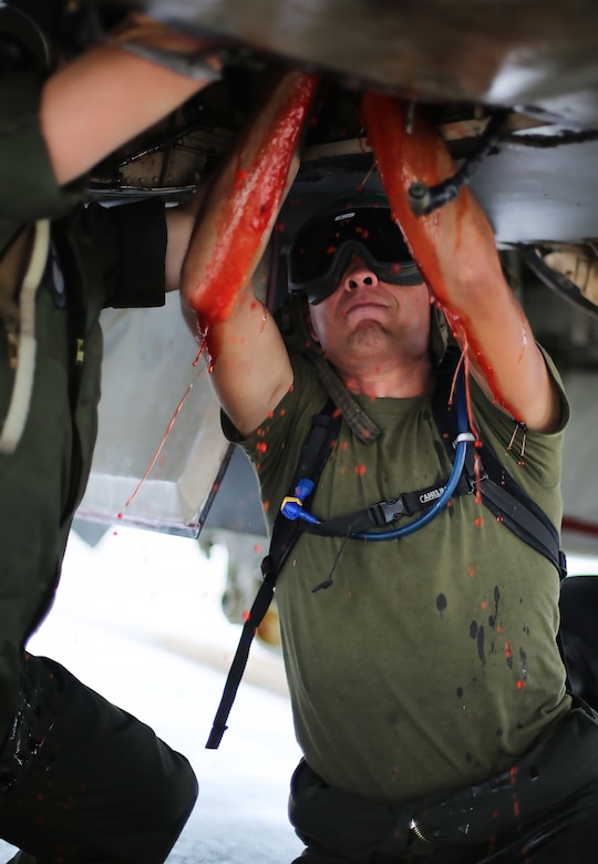 U.S. Marine Corps airframes mechanics assigned to Marine All Weather Fighter Attack Squadron (VMFA(AW)) 242 removes a hydraulic pump from an F/A-18D Hornet after a flight mission during Exercise Valiant Shield 16 at Andersen Air Force Base, Guam, Sept. 18, 2016. Powerliners, airframes mechanics, communication navigation and ordnance technicians, work around the clock to ensure flight schedules are met for aviation operations during the exercise. During this U.S.-only, biennial field training exercise, F/A-18D Hornets flew in a plethora of missions that emphasize joint integration, interoperability and expeditionary readiness. (U.S. Marine Corps photo by Sgt. Jessica Quezada)