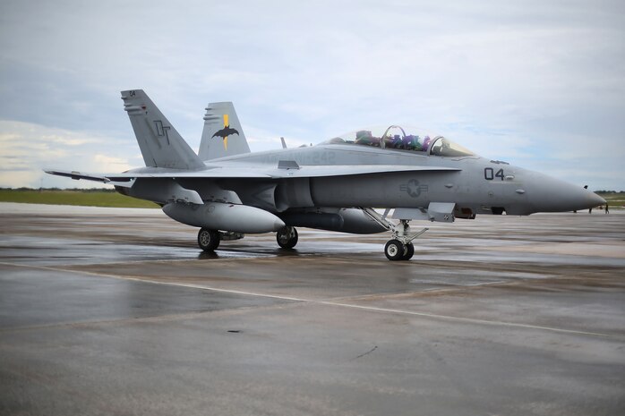 An F/A-18D Hornet assigned to Marine All Weather Fighter Attack Squadron (VMFA(AW)) 242 taxis down the flight line during Exercise Valiant Shield 16 at Andersen Air Force Base, Guam, Sept. 18, 2016. Powerliners, airframes mechanics, communication navigation, and ordnance technicians, work around the clock to ensure flight schedules are met for aviation operations during the exercise. During this U.S.-only, biennial field training exercise, F/A-18D Hornets flew in a plethora of missions that emphasize joint integration, interoperability and expeditionary readiness. (U.S. Marine Corps photo by Sgt. Jessica Quezada) 