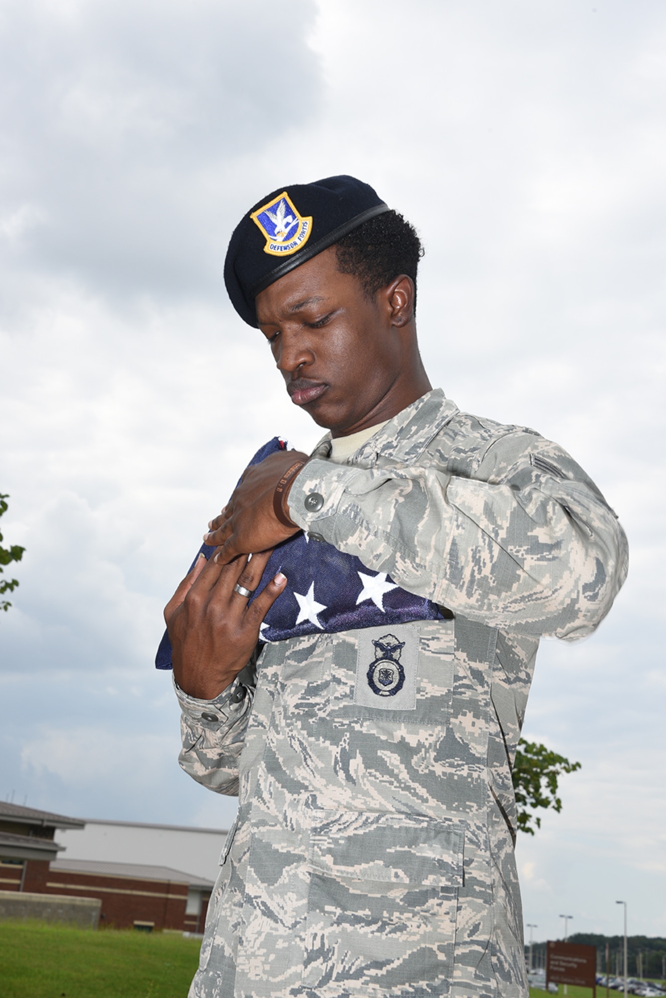 Senior Airman Scott folds the American flag in accordance with customs during Retreat on August 7, 2016 at Memphis Air National Guard Base in Memphis, TN. (U.S. Air National Guard photo by Master Sergeant Danial Mosher/Released)