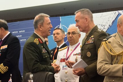 Turkey’s chief of defense, Gen. Hulusi Akar, left, and Marine Corps Gen. Joe Dunford, the chairman of the Joint Chiefs of Staff, talk between sessions during the NATO Military Committee conference in Split, Croatia, Sept. 17, 2016. The alliance’s chiefs of defense discussed current events and implementing the decisions made at the recent NATO summit. DoD photo by D. Myles Cullen