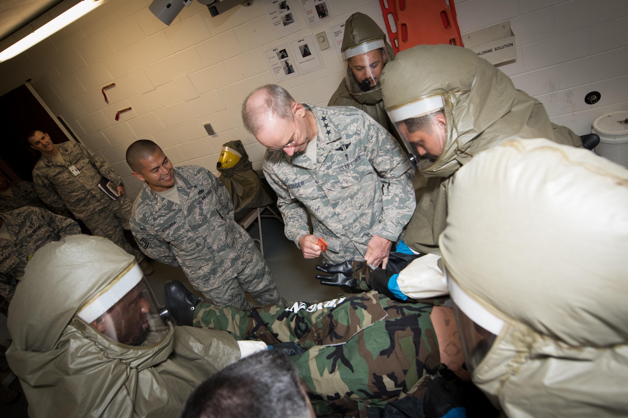 Lt. Gen. (Dr.) Mark A. Ediger, Surgeon General of the Air Force, Headquarters U.S. Air Force, Washington, D.C., practices contingency medical procedures with 51st Medical Group Airmen Sept. 14, 2016, at Osan Air Base, Republic of Korea. Ediger toured various medical facilities within the group to observe the progress and challenges of AF military treatment facilities. (U.S. Air Force photo by Senior Airman Dillian Bamman)