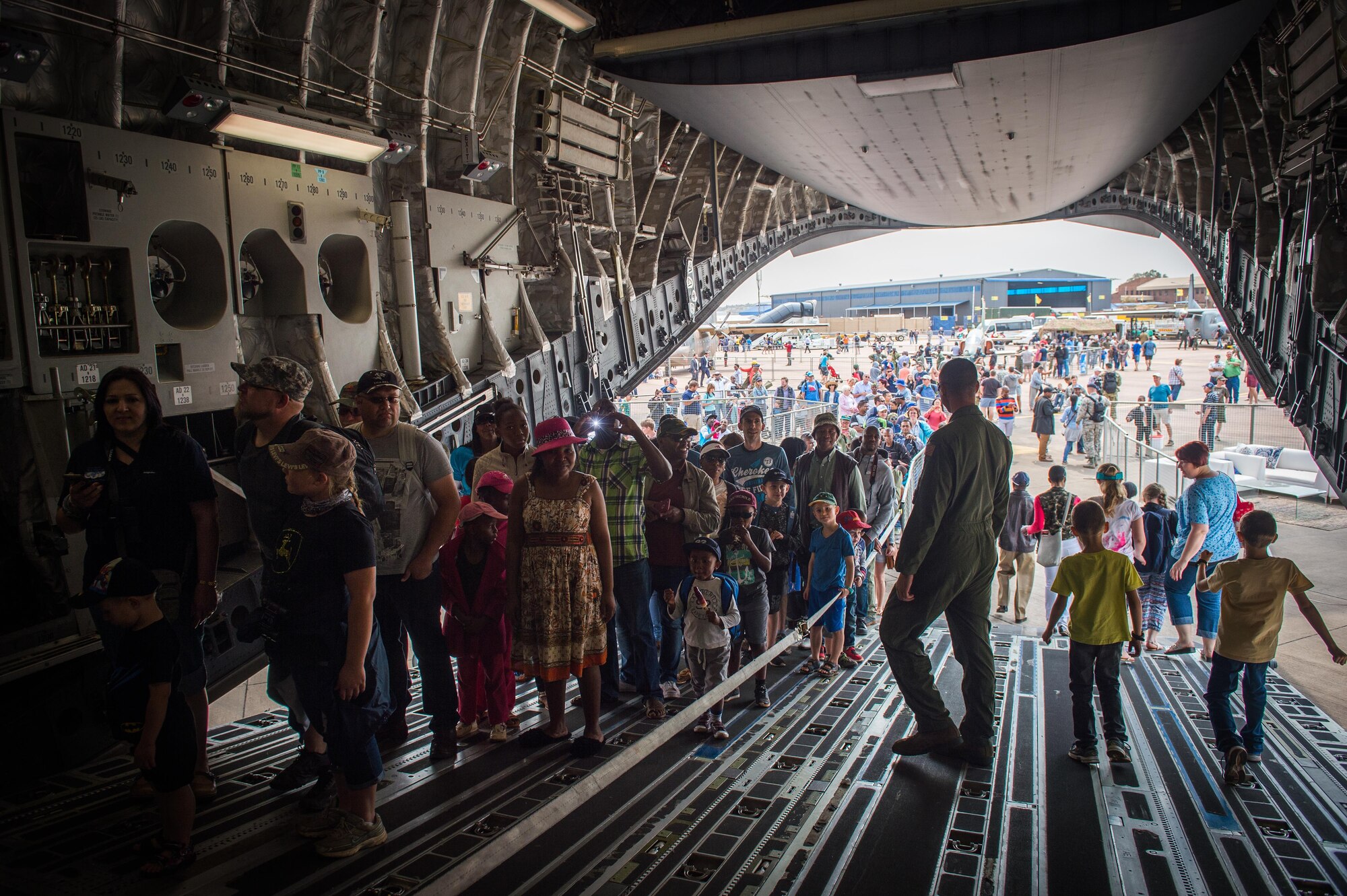 Hundreds of people line up to tour the inside of a C-17, the largest aircraft on display at the Africa Aerospace and Defense Expo at Waterkloof Air Force Base, South Africa, Sept. 17, 2016. The U.S. military is exhibiting a C-17 Globemaster III, a KC-135 Stratotanker, a C-130J Super Hercules, an HC-130 King, and an MQ-9 Reaper. The aircraft come from various Air National Guard and Air Force Reserve Command units. The U.S. routinely participates in events like AADE to strengthen partnerships with regional partners. (U.S. Air Force photo by Tech. Sgt. Ryan Crane)