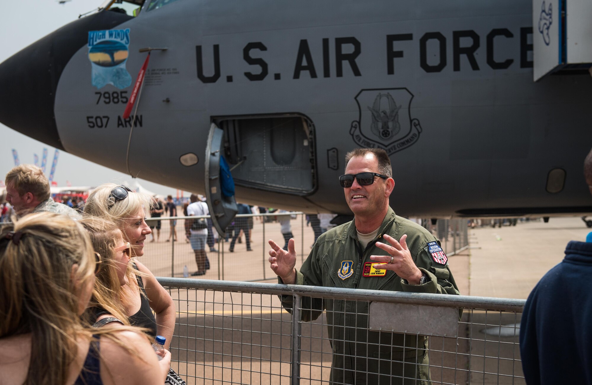 Chief Master Sgt. Steve Robinson, KC-135 boom operator from Oklahoma, explains the mission of his aircraft to airshow attendees at the Africa Aerospace and Defense Expo at Waterkloof Air Force Base, South Africa, Sept. 17, 2016. The U.S. military is exhibiting a C-17 Globemaster III, a KC-135 Stratotanker, a C-130J Super Hercules, an HC-130 King, and an MQ-9 Reaper. The aircraft come from various Air National Guard and Air Force Reserve Command units. The U.S. routinely participates in events like AADE to strengthen partnerships with regional partners. (U.S. Air Force photo by Tech. Sgt. Ryan Crane)