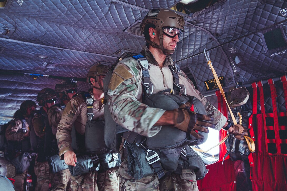 Air Force airmen move to the rear ramp of a CH-47 Chinook helicopter during an air assault and airborne training operation at Fort Drum, N.Y., Sept. 10, 2016. Air National Guard photo by Staff Sgt. Ryan Campbell