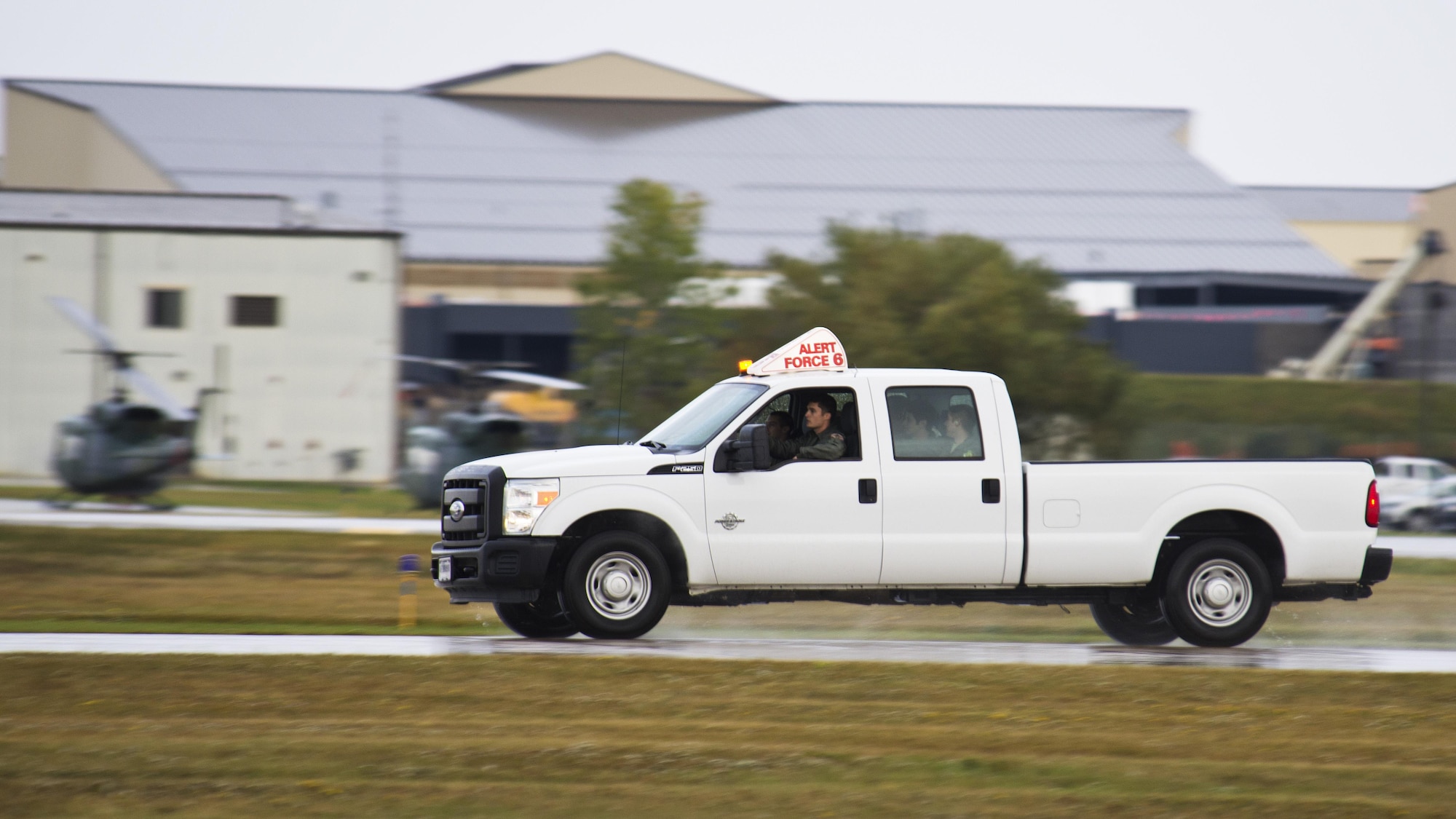 An alert vehicle races to awaiting B-52s during Prairie Vigilance 16-1 at Minot Air Force Base, N.D., Sept. 16, 2016. Approximately 3,500 Airmen from across the 5th Bomb Wing demonstrated safe, secure, reliable nuclear-capable weapons standards and procedures during the weapons generations and fly off. (U.S. Air Force photo/Airman 1st Class J.T. Armstrong)