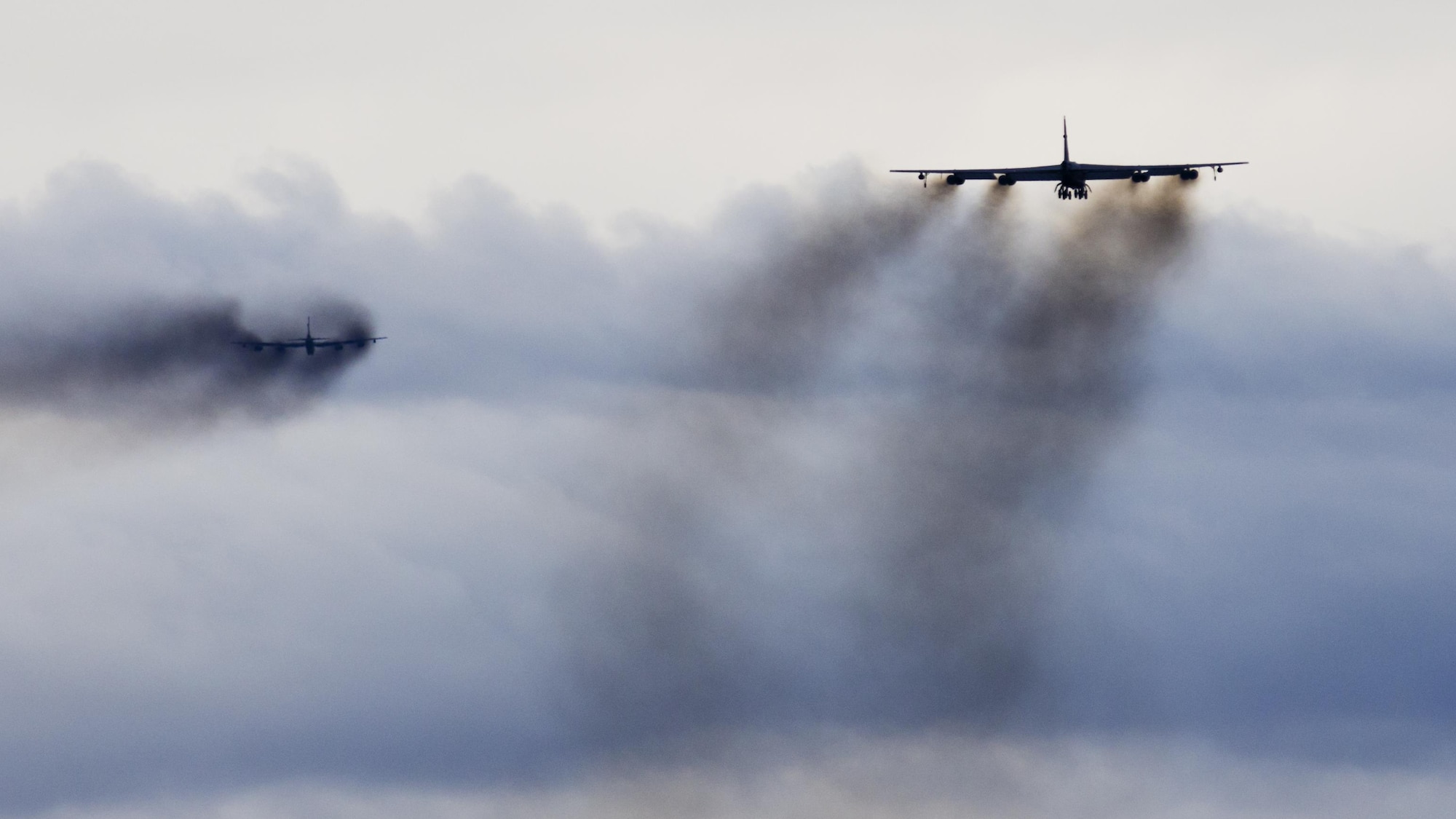 Two B-52H Stratofortresses soar through the air during Prairie Vigilance 16-1 at Minot Air Force Base, N.D., Sept. 16, 2016. The exercise concluded with the rapid fly- off, successfully launching a sequence of 12 B-52s to showcase their active capability to execute the mission. (U.S. Air Force photo/Airman 1st Class J.T. Armstrong)