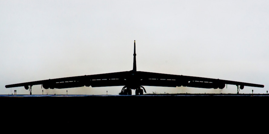 A silhouetted B-52H Stratofortress taxis down the runway during Prairie Vigilance 16-1 at Minot Air Force Base, N.D., Sept. 16, 2016. The exercise concluded with the rapid fly-off, successfully launching a sequence of 12 B-52s to showcase their active capability to execute the mission. (U.S. Air Force photo/Airman 1st Class J.T. Armstrong)