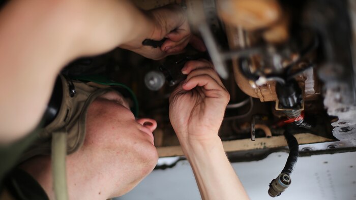 An airframes mechanic assigned to Marine All Weather Fighter Attack Squadron 242 performs maintenance on an F/A-18D Hornet after a flight mission during Exercise Valiant Shield 16 at Andersen Air Force Base, Guam, Sept. 18, 2016. Powerliners, airframes mechanics, communication navigation, and ordnance technicians, work around the clock to ensure flight schedules are met for aviation operations during the exercise. During this U.S.-only, biennial field training exercise, F/A-18D Hornets flew in a plethora of missions that emphasize joint integration, interoperability and expeditionary readiness.