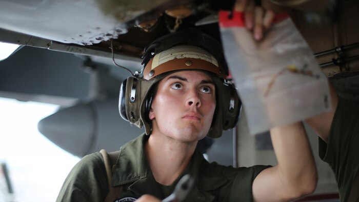 Lance Cpl. Nick Cox, a powerliner assigned to Marine All Weather Fighter Attack Squadron 242 performs maintenance on an F/A-18D Hornet after a flight mission during Exercise Valiant Shield 16 at Andersen Air Force Base, Guam, Sept. 18, 2016. Powerliners, airframes mechanics, communication navigation, and ordnance technicians, work around the clock to ensure flight schedules are met for aviation operations during the exercise. During this U.S.-only, biennial field training exercise, F/A-18D Hornets flew in a plethora of missions that emphasize joint integration, interoperability and expeditionary readiness.
