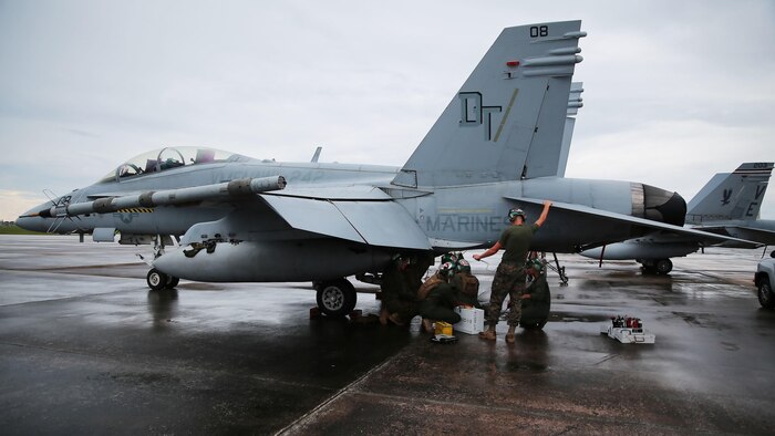 Powerliners assigned to Marine All Weather Fighter Attack Squadron 242 perform maintenance on an F/A-18D Hornet after a flight mission during Exercise Valiant Shield 16 at Andersen Air Force Base, Guam, Sept. 18, 2016. Powerliners, airframes mechanics, communication navigation, and ordnance technicians, work around the clock to ensure flight schedules are met for aviation operations during the exercise. During this U.S.-only, biennial field training exercise, F/A-18D Hornets flew in a plethora of missions that emphasize joint integration, interoperability and expeditionary readiness.