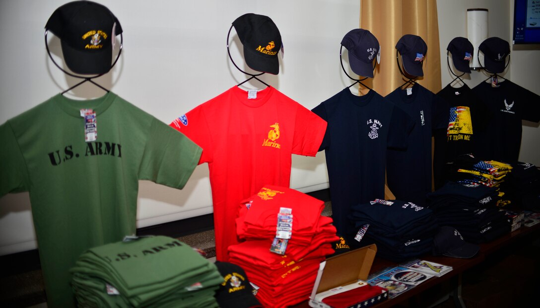 Military T-shirts from the Made in America store are displayed in the Community Activity Center during Retiree Appreciation Day. The events of the day included tours of the C-130 aircraft and base, buffet lunch and retiree fair, hosted by Niagara Falls Air Reserve Station, N.Y. , September 17, 2016. (U.S. Air Force photo by Tech. Sgt. Steph Sawyer) 