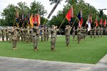 Soldiers of the Georgia Army National Guard’s 48th Infantry Brigade Combat Team and the active component’s 3rd Infantry Division salute during a patch changing ceremony at Fort Stewart, Georgia, where the Soldiers of the 48th IBCT officially donned the shoulder sleeve insignia of the 3rd ID. The two units have been paired together as part of the associated unit program, which integrates reserve and active component units at nearly all levels to enhance training, readiness and the ability to deploy. 