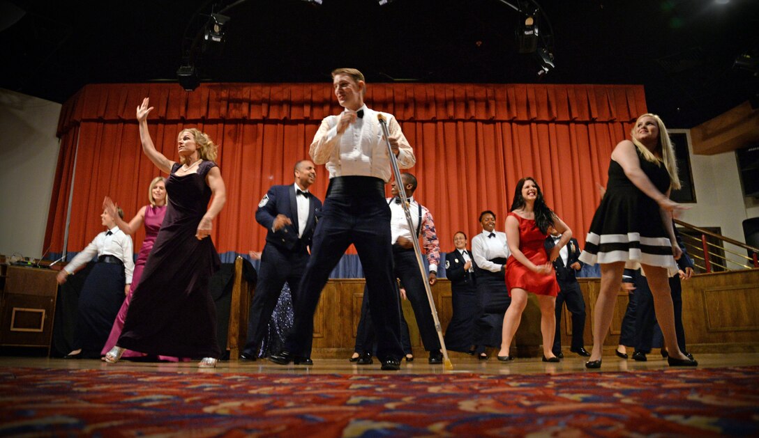 Team Mildenhall Airmen and spouses dance as a flash mob during the Air Force Ball Sept. 17, 2016, on RAF Mildenhall, England. The flash mob was an ice-breaker to help get the event started. This year marks the U.S. Air Force’s 69th birthday. (U.S. Air Force photo by Senior Airman Christine Halan)