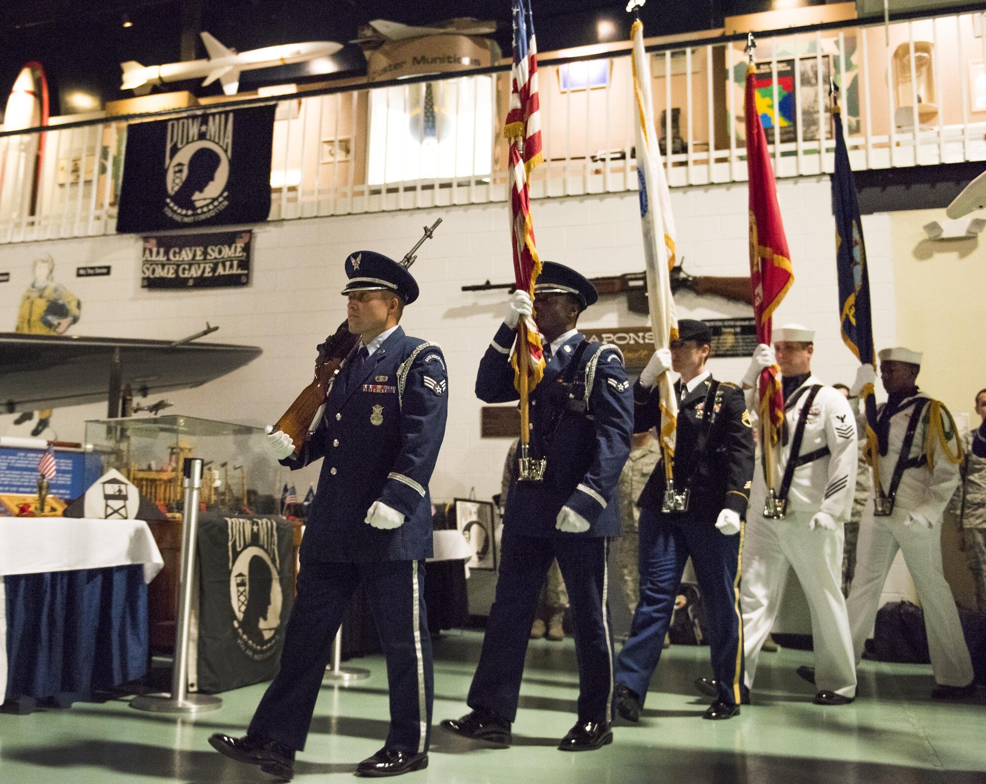 Senior Airman Keith Wheeldon leads a joint service color guard during the presentation of the colors during the POW/MIA Recognition Day ceremony Sept. 16 at the Air Force Armament Museum. The ceremony paid tribute to those military members who have yet to return home from defending America. The event featured tributes, guest speakers, honor guard procedures and a 53rd Wing F-15 and F-16 flyover. (U.S. Air Force photo/Samuel King Jr.)
