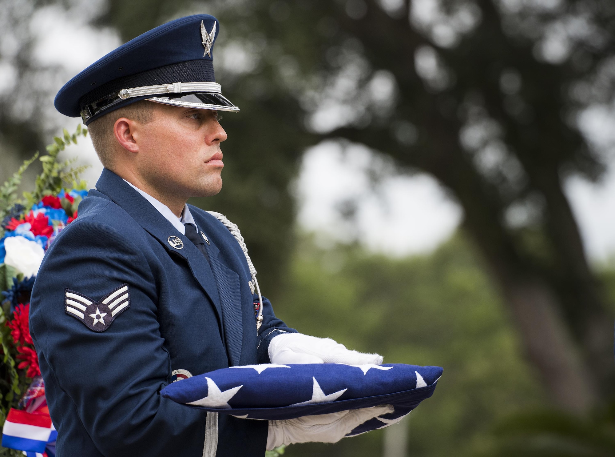 Senior Airman Keith Wheeldon, Eglin Air Force Base honor guard, holds an American flag at the POW/MIA Recognition Day event Sept. 16 at the Air Force Armament Museum. The ceremony paid tribute to those military members who have yet to return home from defending America. The event featured tributes, guest speakers and honor guard procedures. (U.S. Air Force photo/Samuel King Jr.)