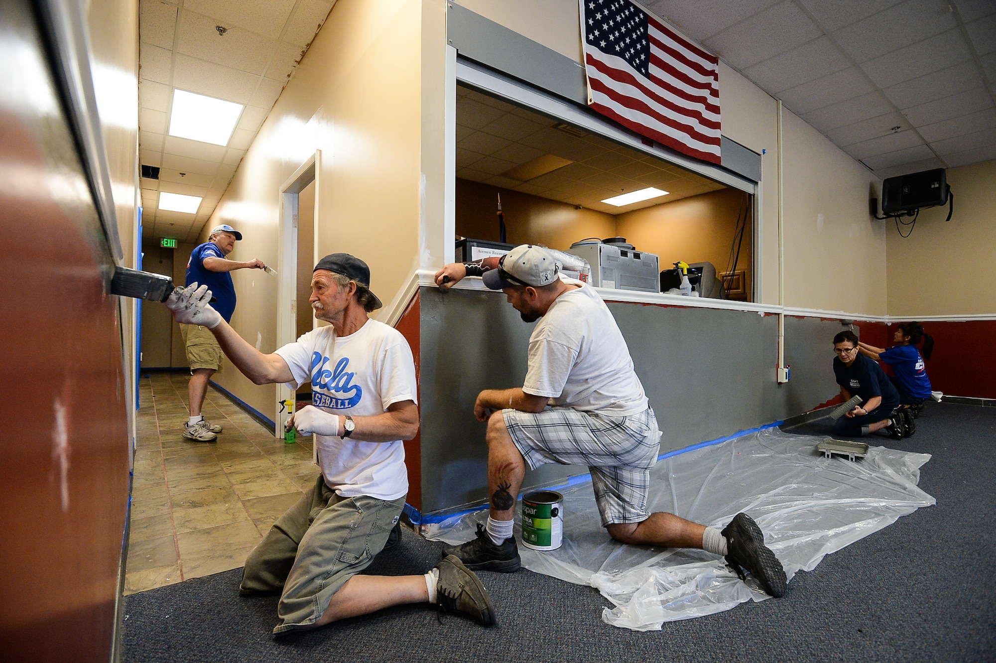 Layton Lowe’s employees paint the walls of the Airman Recreation Center, Hill Air Force Base, Utah, as part of a community relations project, Sept. 13, 2016. (U.S. Air Force photo by R. Nial Bradshaw)