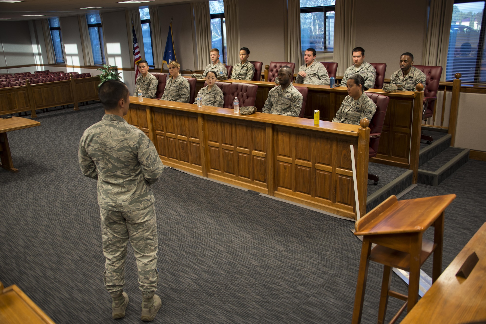 Capt. Joseph Cachuela, 60th Air Mobility Wing Legal Office attorney, front, discusses the different elements involved in a court-martial proceeding with Airmen participating in the True North program at Travis Air Force Base, Calif., Sept. 15, 2016. The True North program showcases the full spectrum of the military judicial process including incarceration. (U.S. Air Force photo by Staff Sgt. Charles Rivezzo)