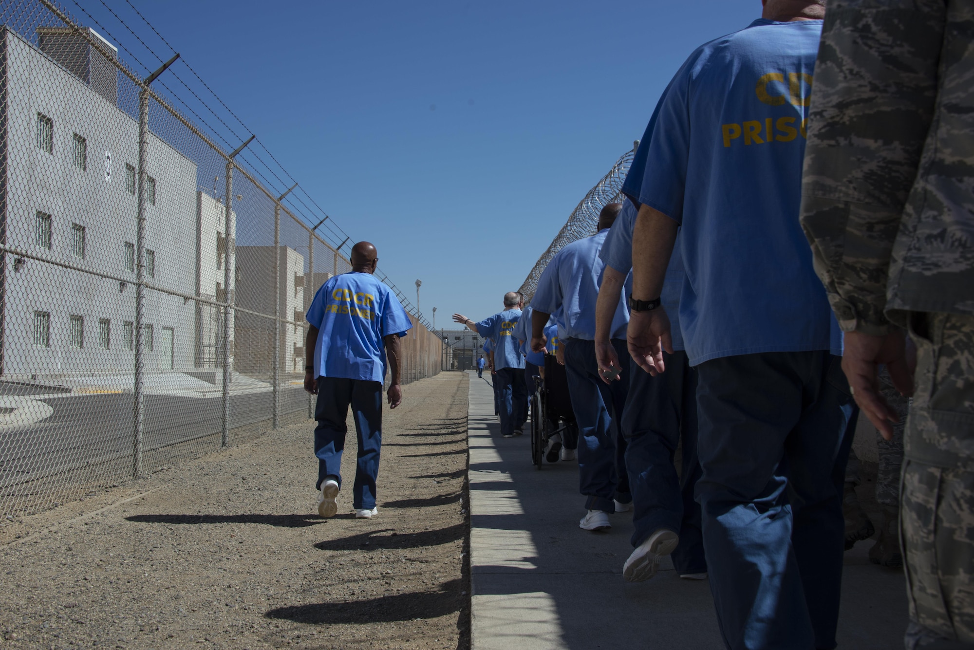 Inmates at the California Medical Facility provide a tour to Airmen participating in the True North program of the prision at the CMF, in Vacaville, Calif., Sept. 15, 2016. As part of the program, Airmen meet with inmates at CMF and hear their personal stories as well as tour the facility. (U.S. Air Force photo by Staff Sgt. Charles Rivezzo)