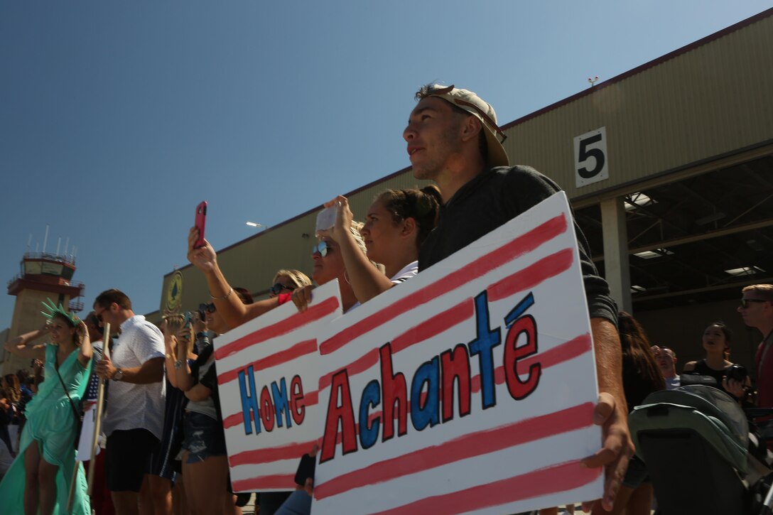 Family and friends wait for the arrival of service members with Marine Light Attack Helicopter Squadron (HMLA) 267 aboard Marine Corps Air Station Camp Pendleton, Calif., Sept. 10. HMLA-267 and other units from 3rd Marine Aircraft Wing returned from a seven-month deployment with the 13th Marine Expeditionary Unit after conducting operations from the Western Pacific to the Arabian Gulf to include strikes against ISIL targets in Iraq. (U.S. Marine Corps photo by Pfc. Liah Kitchen/Released)