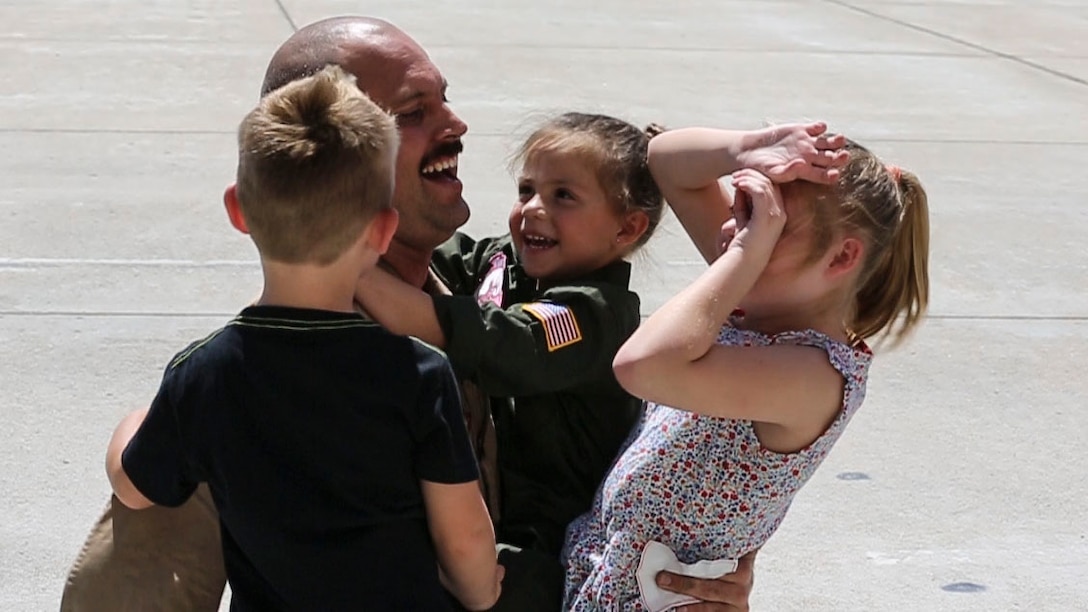 A Marine with Marine Medium Tiltrotor Squadron (VMM) 166 (Reinforced) reunites with his family aboard Marine Corps Air Station Miramar, Calif., Sept. 10 after returning from deployment. VMM-166 (Rein) and other units from 3rd Marine Aircraft Wing returned from a seven-month deployment with the 13th Marine Expeditionary Unit after conducting operations from the Western Pacific to the Arabian Gulf to include strikes against ISIL targets in Iraq. (U.S. Marine Corps photo by Lance Cpl. Jake McClung/Released) 