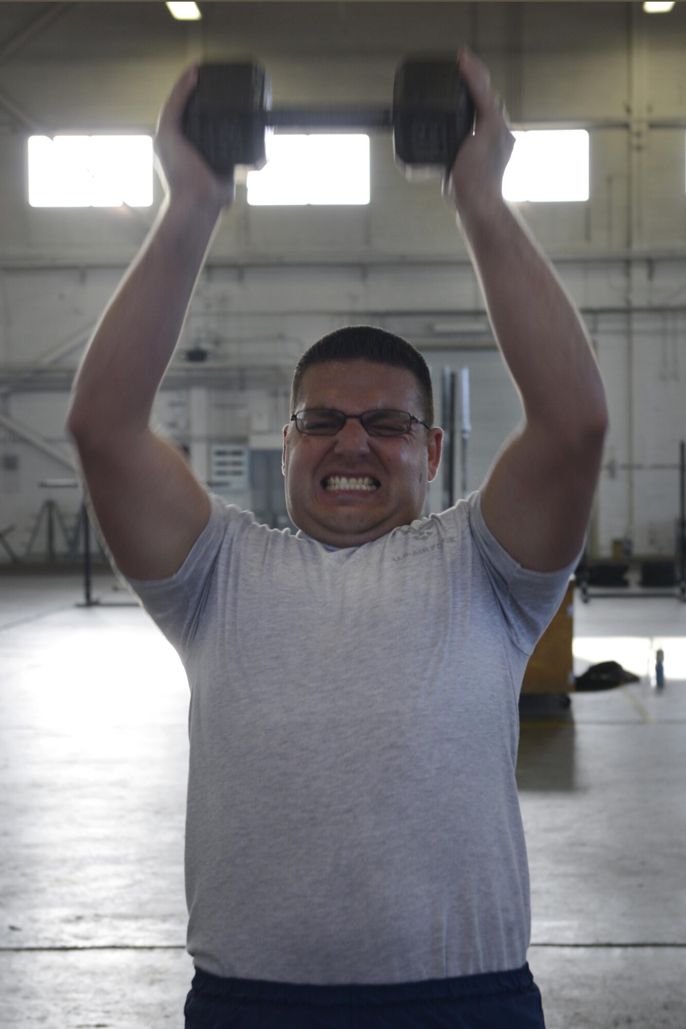 Tech Sgt. Barry Fairbanks, assigned to the 673d Security Forces Squadron, performs a set of repetitions in Hangar 5 at Joint Base Elmendorf-Richardson, Alaska, Aug. 29, 2016. Mobley is part of a six-member team preparing to compete in the Pacific Air Forces Advanced Combat Skills Assessment hosted in Guam, Sept. 25 to 29, 2016. 