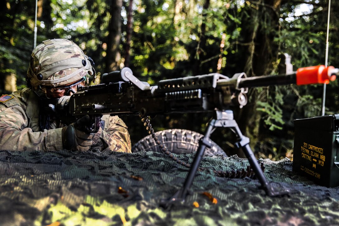 Army Spc. Cody Lucas mans a machine gun as he provides cover for his teammates during defensive operations training as part of exercise Combined Resolve VII in Hohenfels, Germany, Sept. 11, 2016. Lucas is assigned to the 1st Battalion, 41st Field Artillery Regiment, 1st Armored Brigade. Army photo by Pfc. Rachel Wilridge 