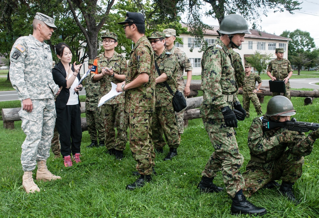 U.S. Army Col. Luis Pomales (left), director, Army Reserve Engagement Team-Japan, observes Japan Ground Self-Defense Reserve Component service members from the 18th Infantry Regiment, 11th Brigade, JGSDF Northern Army, learn the best firing positions for the Howa Type 89 Assault Rifle during a weapons familiarization training exercise conducted Sept. 10, 2016, in Camp Makomanai, Japan. Pomales complimented his JGSDF partners for their professionalism and discipline during the drill. He also explained many similarities and subtle differences between how the U.S. Army Reserve and JGSDF Reserve Component conduct marksmanship training. Commonly referred as, “Buddy,” by JGSDF troops, the Type 89 is gas operated weapon that can fire up to 750 rounds per minute. It was designed with simplified operation and minimal number of parts due to the understanding that the complex structure and large number of parts often hindered the operation of its direct predecessor, the Type 64 Assault Rifle.  (Photo by Sgt. John L. Carkeet IV, U.S. Army Japan)