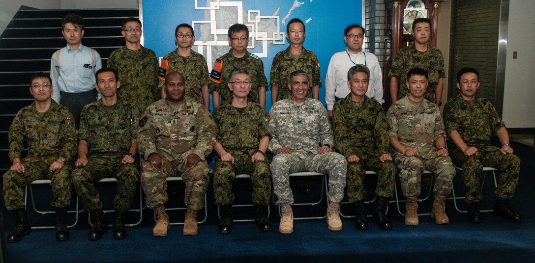 U.S. Army Sgt. Maj. Bennie Nunnally (front row, third from left), senior enlisted advisor, Army Reserve Engagement Team-Japan, Japan Ground Self-Defense Force Col. Katsuya Takagi (front row, center), director, Personnel Department, JGSDF Northern Army, and U.S. Army Col. Luis Pomales (front row, fourth from right), director, ARET-J, join their U.S. Army and JGSDF Northern Army partners for a group photo Sept. 9, 2016, in Camp Sapporo, Japan. Nunnally and Pomales visited Camp Sapporo to meet with their JGSDF Reserve Component partners and learn more about their vision, mission, capabilities and organization. The ARET-J leaders also shared best practices on how to overcome their respective command’s manpower challenges and improve relations between Reserve Component service members and their civilian employers. (Photo by Sgt. John L. Carkeet IV, U.S. Army Japan)