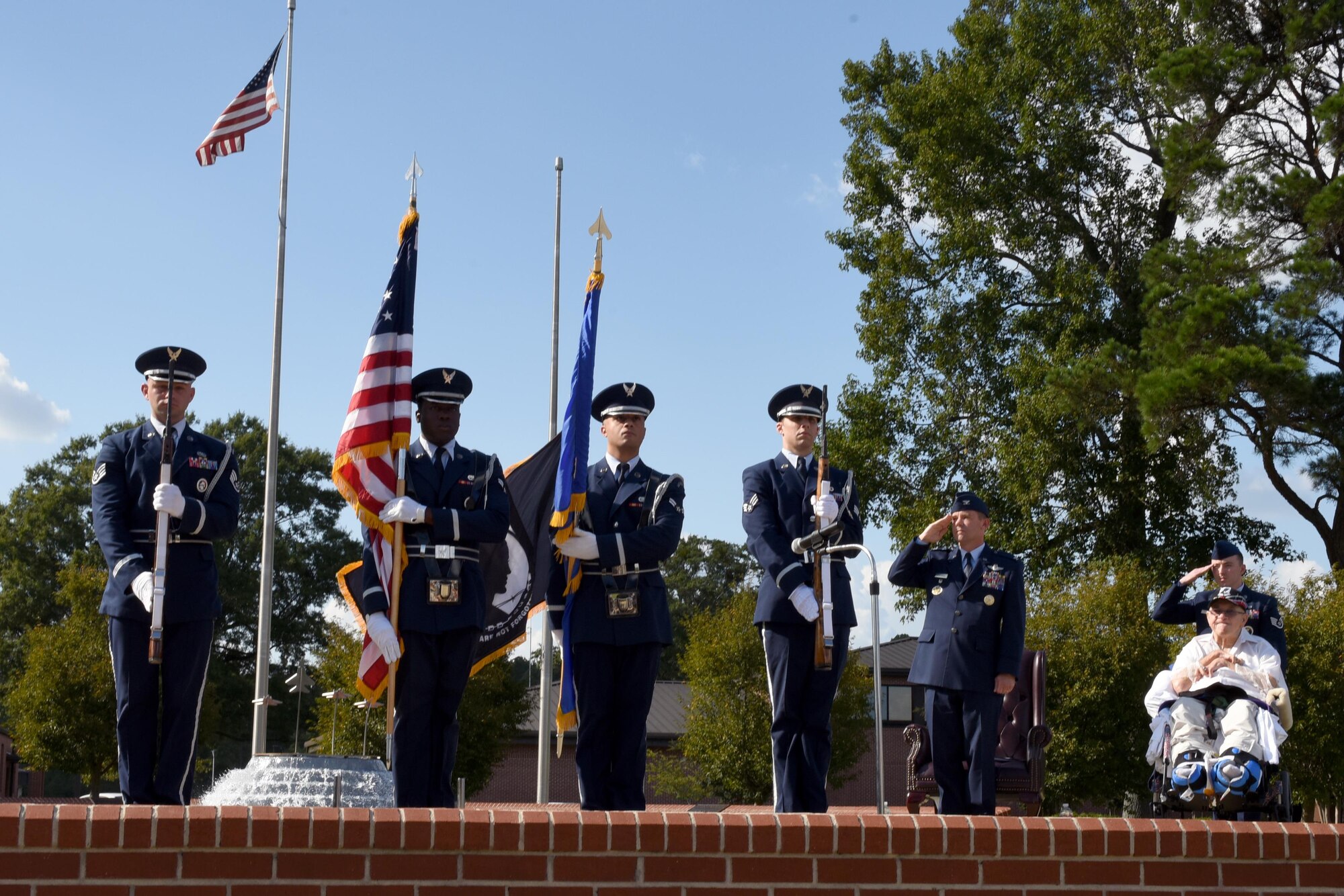 The Seymour Johnson Air Force Base Honor Guard presents the flags during the Prisoner of War/Missing in Action remembrance ceremony, Sept. 15, 2016 at Seymour Johnson Air Force Base, North Carolina. Retired Sgt. 1st Class Gaspar Gonzalez, Korean War POW and former U.S. Army Green Beret, spoke about his experience being held captive and honoring those who never made it home.  (U.S. Air Force photo by Airman Miranda A. Loera)