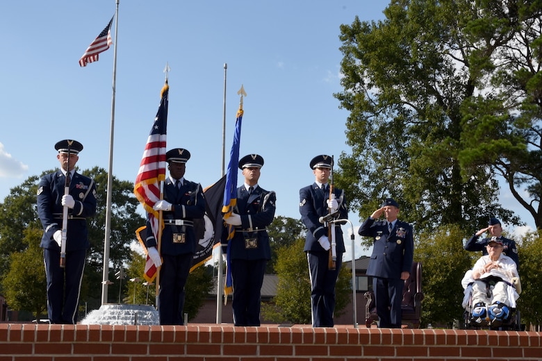 The Seymour Johnson Air Force Base Honor Guard presents the flags during the Prisoner of War/Missing in Action remembrance ceremony, Sept. 15, 2016 at Seymour Johnson Air Force Base, North Carolina. Retired Sgt. 1st Class Gaspar Gonzalez, Korean War POW and former U.S. Army Green Beret, spoke about his experience being held captive and honoring those who never made it home.  (U.S. Air Force photo by Airman Miranda A. Loera)