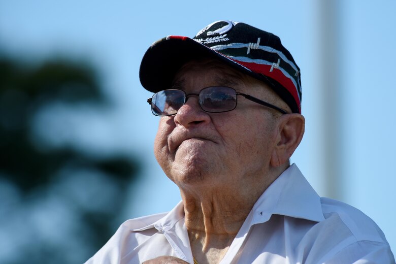 Gaspar Gonzalez, a former Korean War Prisoner of War and U.S. Army Green Beret, listens while the national anthem is played, Sept. 15, 2016, at Seymour Johnson Air Force Base, North Carolina. Gonzalez was the guest speaker during Team Seymour’s annual POW/MIA closing ceremony and spoke about his capture by the Chinese during the Korean War in 1950. (U.S. Air Force photo by Airman Shawna L. Keyes)