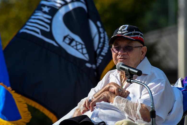 Gaspar Gonzalez, a former Korean War Prisoner of War and U.S. Army Green Beret, speaks to members of Team Seymour during a Prisoners of War/Missing in Action Remembrance Ceremony, Sept. 15, 2016, at Seymour Johnson Air Force Base, North Carolina. Gonzalez spoke to more than 150 members about his time during the Korean War and the time he spent in captivity by the Chinese and his eventual escape. (U.S. Air Force photo by Airman Shawna L. Keyes)